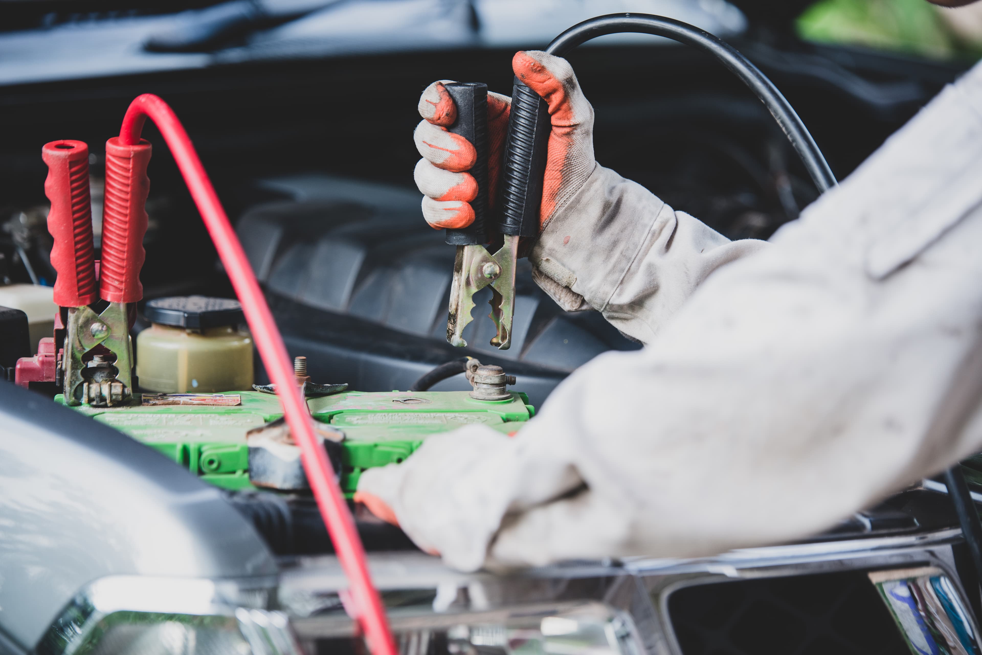 Car battery and electrical wiring in an engine bay