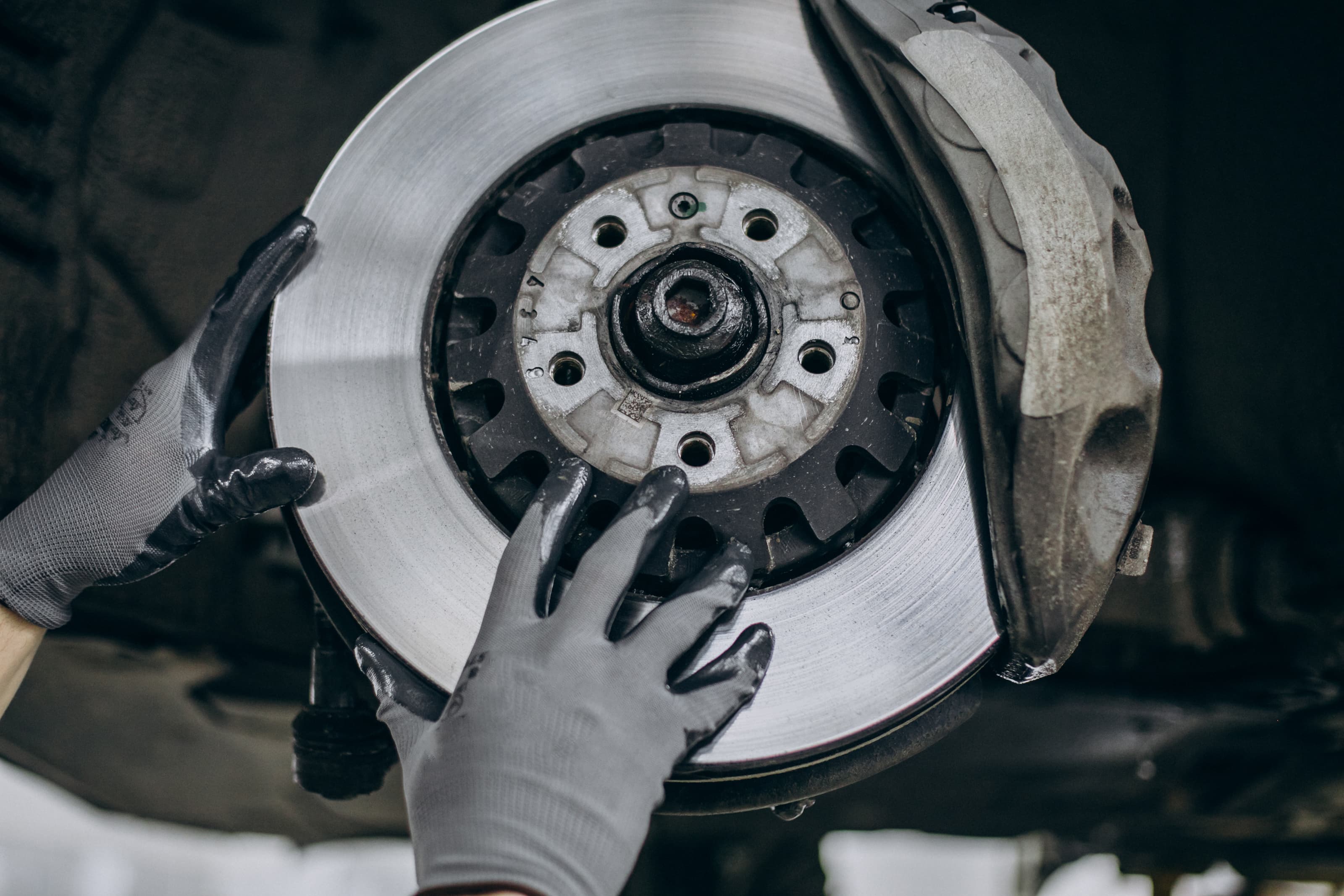 New shiny brake disc and fresh pads installed